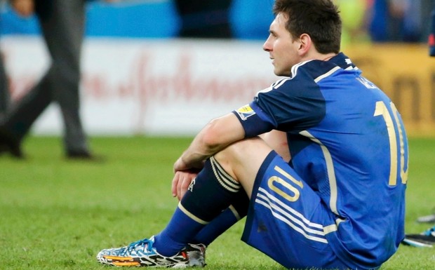 59.+Lionel+Messi+sits+on+the+pitch+after+losing+the+final+against+Germany+at+the+Estádio+Maracanã+in+Rio+de+Janeiro.+Reuters